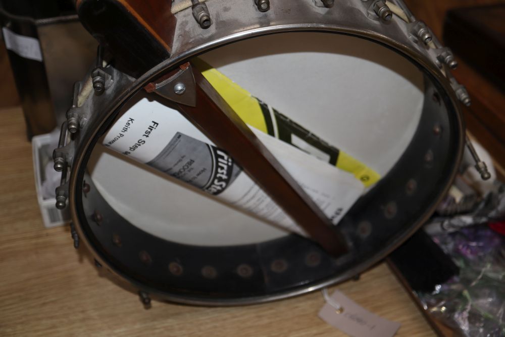 A six string banjo, length 94cm
